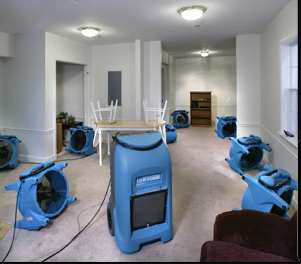 Air movers and dehumidifier setup for Water Damage Restoration in Belding